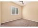 Neutral bedroom with a window providing natural light and ceiling fan overhead at 10501 W Swayback Pass, Peoria, AZ 85383