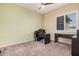 Bedroom featuring large windows, and neutral carpet at 10501 W Swayback Pass, Peoria, AZ 85383