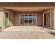 Covered patio with a sliding glass door, ceiling lights, and a brick paved entry way at 10501 W Swayback Pass, Peoria, AZ 85383