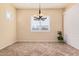 Cozy dining area with chandelier lighting and plantation shutters at 10501 W Swayback Pass, Peoria, AZ 85383