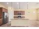 Spacious kitchen with granite counters, stainless steel appliances and center island at 10501 W Swayback Pass, Peoria, AZ 85383