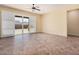 Spacious living room with tile floors and access to the backyard at 10501 W Swayback Pass, Peoria, AZ 85383