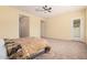 Large main bedroom featuring neutral carpet, ample space, and natural light at 10501 W Swayback Pass, Peoria, AZ 85383