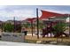 Community playground at WestWing Park with shade structures, slides, and play equipment at 10501 W Swayback Pass, Peoria, AZ 85383