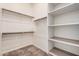 Walk-in closet with shelving and hanging rods, and carpet flooring at 10501 W Swayback Pass, Peoria, AZ 85383