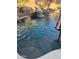 Relaxing pool with waterfall feature and pebble finish at 11340 E Stearn Ave, Mesa, AZ 85212