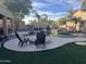 Inviting backyard oasis with a pool and fire pit at 11340 E Stearn Ave, Mesa, AZ 85212