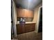 Storage room with wooden cabinets and granite countertop at 11340 E Stearn Ave, Mesa, AZ 85212