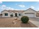 Well-maintained home has desert landscaping, a two-car garage, and a welcoming entrance at 14701 W Sentinel Dr, Sun City West, AZ 85375