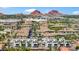 Aerial view of community featuring modern townhouses with a pool and mountain backdrop at 1501 N Miller Rd # 1003, Scottsdale, AZ 85257
