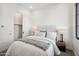 Comfortable bedroom with a queen bed, closet, and stylish decor at 1501 N Miller Rd # 1003, Scottsdale, AZ 85257