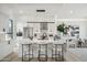Modern kitchen with marble island, stainless steel appliances, and white cabinetry at 1501 N Miller Rd # 1003, Scottsdale, AZ 85257