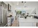 Modern kitchen features stainless steel appliances and a large marble island at 1501 N Miller Rd # 1003, Scottsdale, AZ 85257