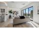 Spacious living room with modern furniture and sliding glass doors to a patio at 1501 N Miller Rd # 1003, Scottsdale, AZ 85257