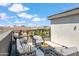 Relaxing rooftop deck with city views, comfortable seating, and modern design at 1501 N Miller Rd # 1003, Scottsdale, AZ 85257
