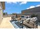 Relaxing rooftop patio with seating area, perfect for outdoor entertaining at 1501 N Miller Rd # 1003, Scottsdale, AZ 85257