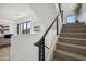 Modern staircase with metal railing leading to the upper level at 1501 N Miller Rd # 1003, Scottsdale, AZ 85257