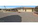 Large backyard with gravel and solar panels on the house at 15809 N Bowling Green Dr, Sun City, AZ 85351