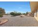 Landscaped backyard with gravel and a patio area at 15809 N Bowling Green Dr, Sun City, AZ 85351