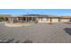Large backyard with gravel and solar panels on the house at 15809 N Bowling Green Dr, Sun City, AZ 85351
