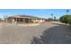 Large backyard with gravel and solar panels on the house at 15809 N Bowling Green Dr, Sun City, AZ 85351