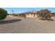 Large backyard with gravel and solar panels on the house at 15809 N Bowling Green Dr, Sun City, AZ 85351
