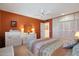 Bedroom with bed, ceiling fan, and dresser at 15809 N Bowling Green Dr, Sun City, AZ 85351
