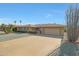 Ranch home with a two-car garage and desert landscaping at 15809 N Bowling Green Dr, Sun City, AZ 85351