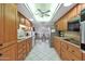 Well-equipped kitchen with ample cabinetry and tile flooring at 15809 N Bowling Green Dr, Sun City, AZ 85351