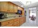 Open kitchen with granite counters, good cabinet space, and a view of dining area at 15809 N Bowling Green Dr, Sun City, AZ 85351