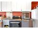 Bright laundry room, featuring a washer, dryer, and ample storage at 15809 N Bowling Green Dr, Sun City, AZ 85351