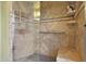 Walk-in shower with tiled walls and seat at 15809 N Bowling Green Dr, Sun City, AZ 85351