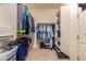 Walk-in closet with ample storage space and organization systems for clothes and accessories at 16442 W Berkeley Rd, Goodyear, AZ 85395