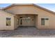 Backyard includes a covered patio with ceiling fan and desert landscaping for easy maintenance at 17750 W Watson Ln, Surprise, AZ 85388