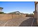 Expansive backyard includes desert landscaping, and a brick wall at 17750 W Watson Ln, Surprise, AZ 85388
