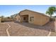 Expansive backyard with low maintenance desert landscaping is perfect for relaxing and enjoying the Arizona sunshine at 17750 W Watson Ln, Surprise, AZ 85388