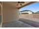 Covered patio with ceiling fan has backyard views at 17750 W Watson Ln, Surprise, AZ 85388