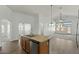 Modern kitchen featuring stainless steel appliances, a convenient island, and tile flooring ideal for cooking and entertaining at 17750 W Watson Ln, Surprise, AZ 85388