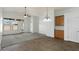 Spacious living room with high ceilings, ceiling fan, neutral carpet and lots of natural light at 17750 W Watson Ln, Surprise, AZ 85388