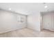 This is a neutral, carpeted bedroom with a window and recessed lighting at 17857 W Getty Dr, Goodyear, AZ 85338