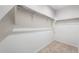 Walk-in closet with neutral carpet and white rods for ample storage at 17857 W Getty Dr, Goodyear, AZ 85338