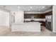 Modern kitchen boasts granite countertops, stainless steel appliances, and a large island at 17857 W Getty Dr, Goodyear, AZ 85338