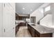 Eat-in kitchen with granite countertops, stainless steel appliances, and modern finishes at 17857 W Getty Dr, Goodyear, AZ 85338