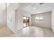Living area with a large sliding glass door that leads to an outdoor patio area at 17857 W Getty Dr, Goodyear, AZ 85338