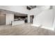 Spacious living room featuring tile floors, stainless steel appliances, and granite countertops at 17857 W Getty Dr, Goodyear, AZ 85338