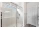 A beautifully tiled shower with glass door and window for natural light at 17857 W Getty Dr, Goodyear, AZ 85338