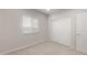 This bedroom offers natural light, a large closet, and a door to the hall at 17875 W Getty Dr, Goodyear, AZ 85338