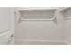 A walk-in closet with white shelves and plenty of space for storage at 17875 W Getty Dr, Goodyear, AZ 85338