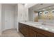 Bathroom boasts dual sinks and a large mirror at 17876 W Encinas Ln, Goodyear, AZ 85338