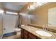 Bathroom featuring granite countertops, and a bathtub with shower at 18017 W Desert Ln, Surprise, AZ 85388
